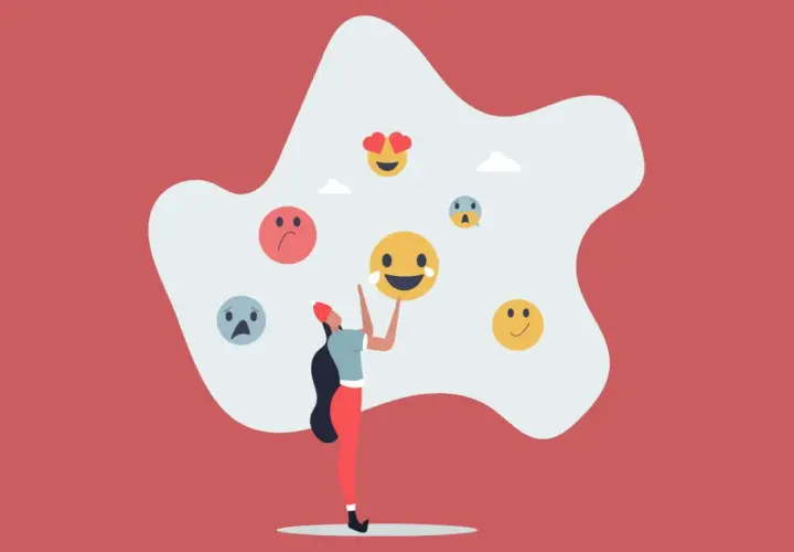 Una persona rodeada de emojis que reflejan sentimientos encontrados.