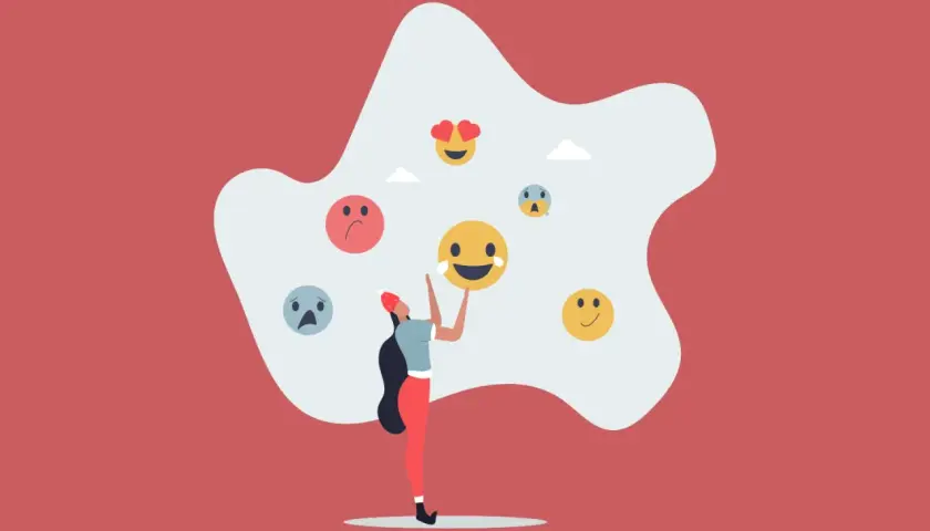 Una persona rodeada de emojis que reflejan sentimientos encontrados.