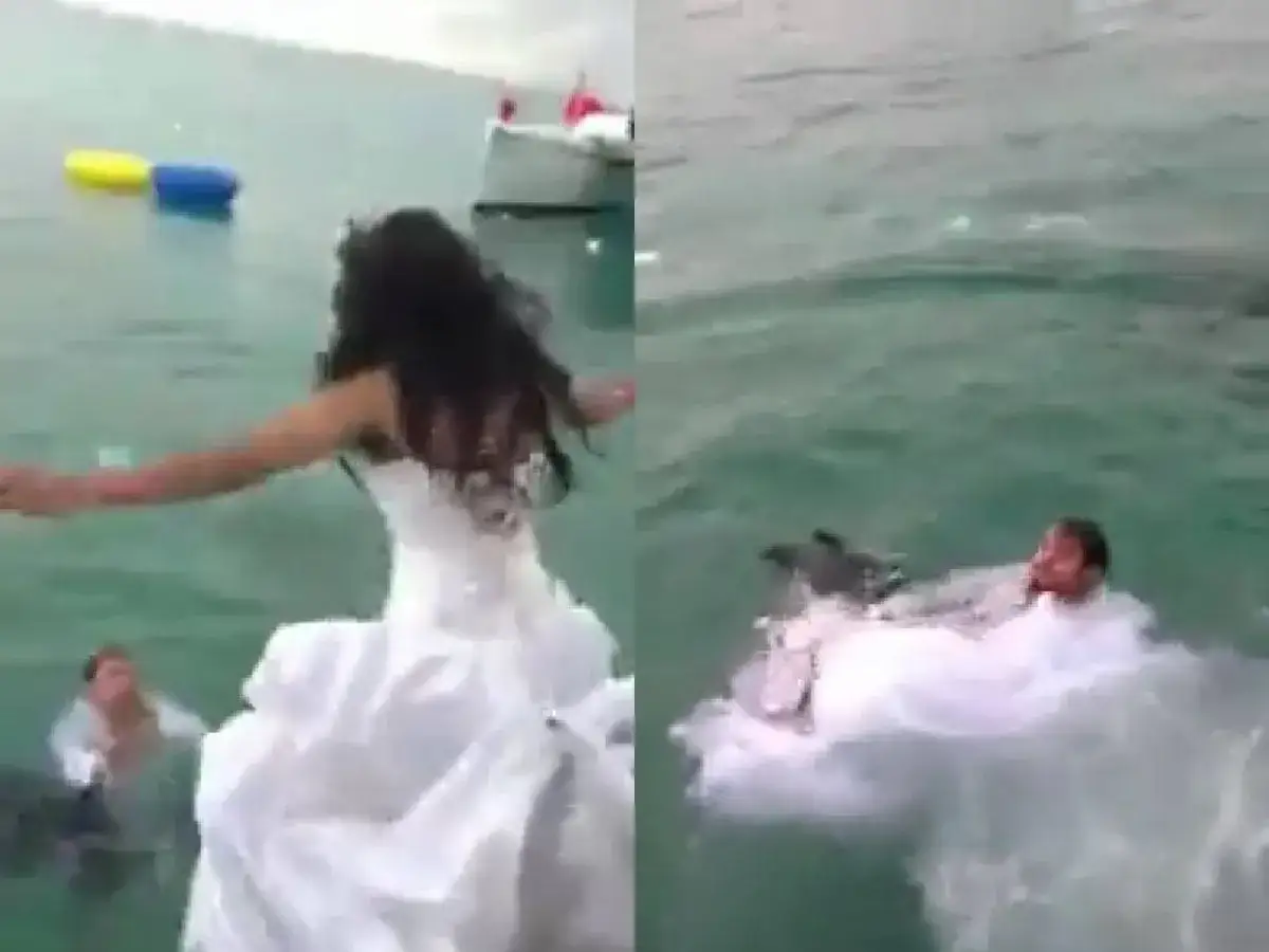 Novia en vestido blanco se lanza al agua, un novio ya est&aacute; dentro. &iexcl;Una divertida sesi&oacute;n de trash the dress!