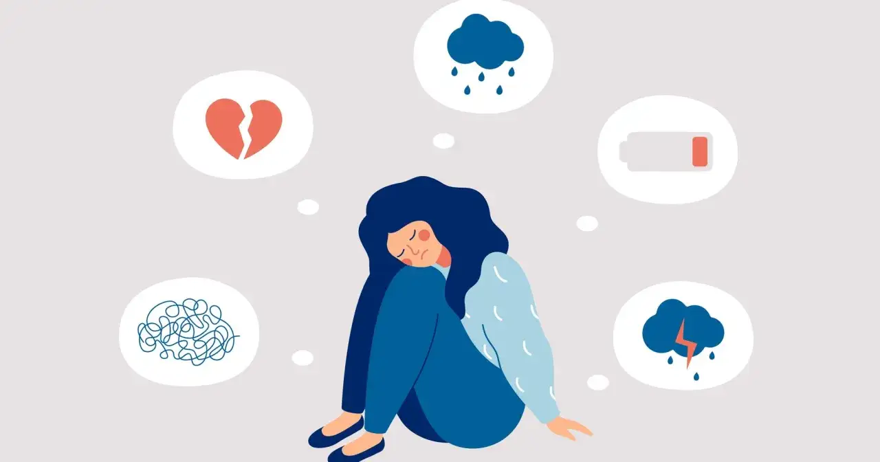 Una mujer sentada con los ojos cerrados, rodeada de burbujas con un corazón roto, una nube con lluvia, una batería baja y un cerebro enredado, reflejando sentimientos encontrados.